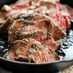 Sliced Tri Tip Steak in a cast iron pan