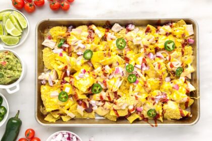 cooked nachos on baking sheet