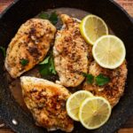 lemon pepper chicken in a pan.