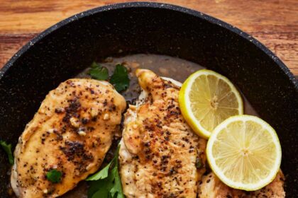 lemon pepper chicken in a pan.