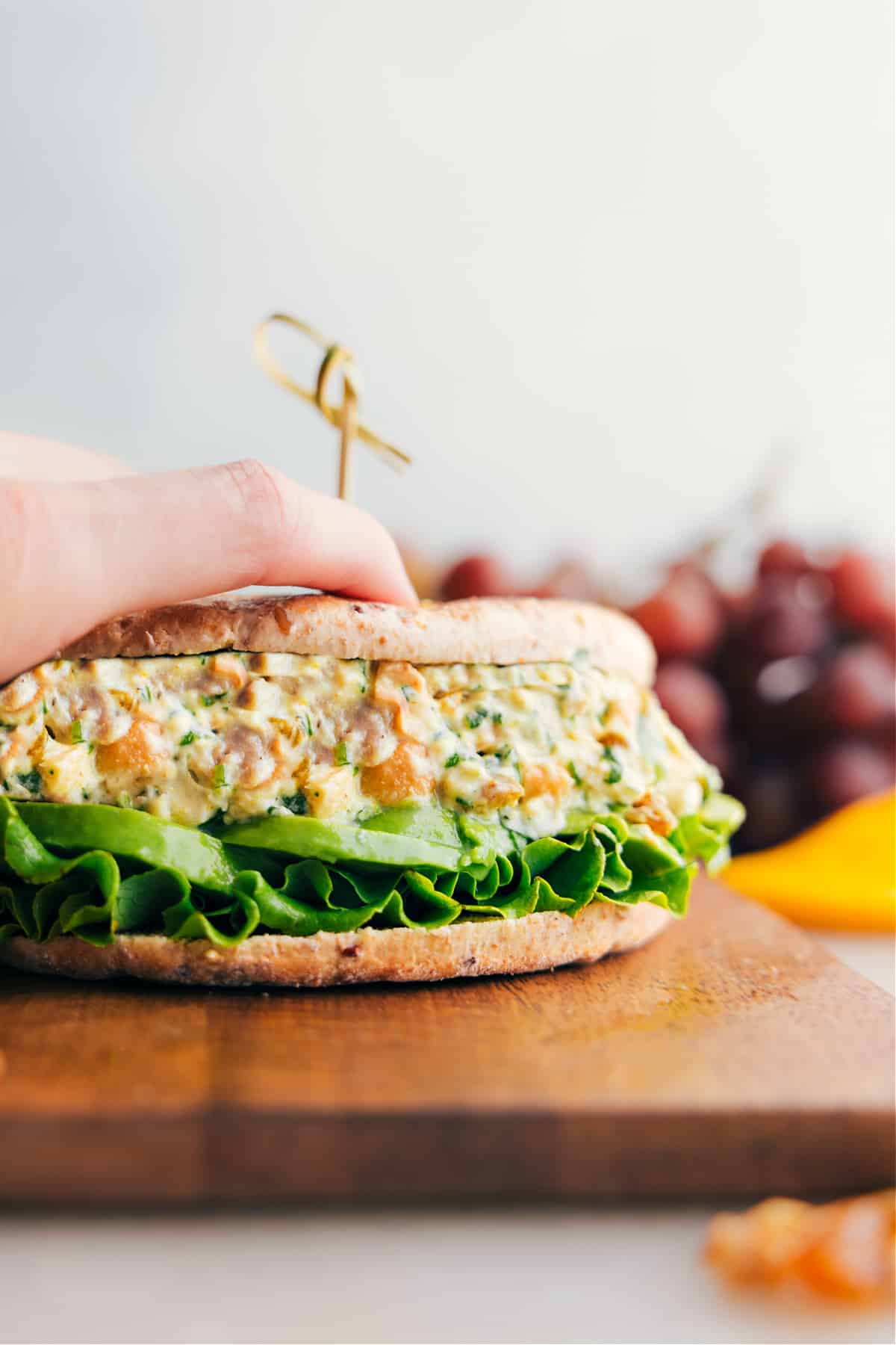 Curry Chicken Salad in a sandwich with lettuce and avocado, the perfect mix.