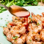 Marinated grilled shrimp plated and garnished.