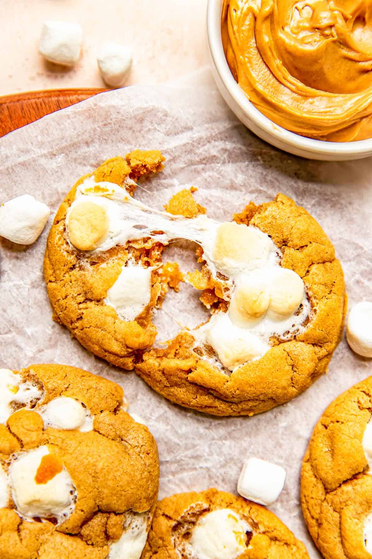 a fluffernutter cookie is pulled apart to show gooey marshmallow