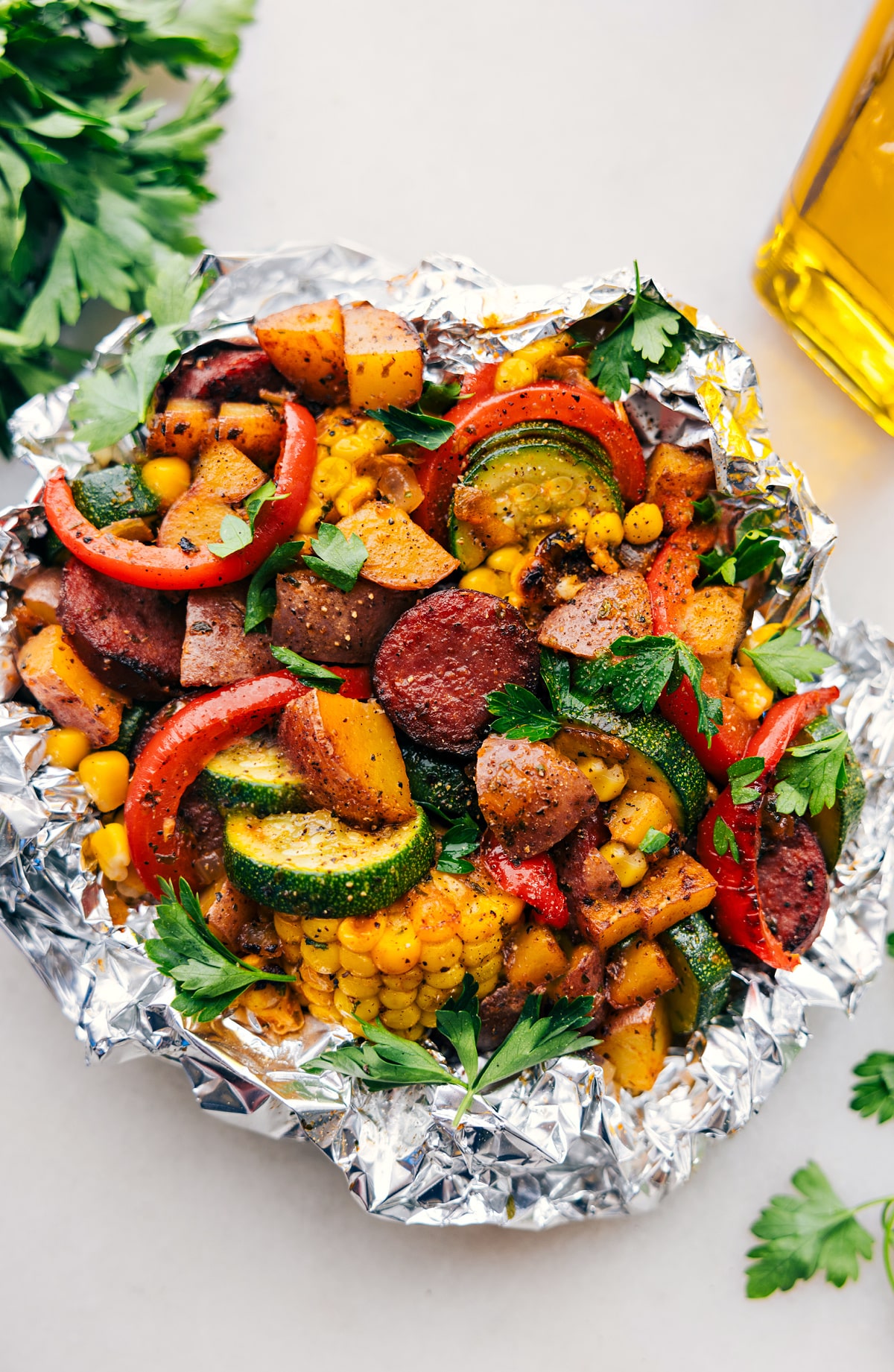 Tin Foil Sausage and Veggies Dinner fresh off the grill ready to be enjoyed.