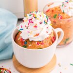 Air Fryer Funfetti Mug Cake with whipped topping