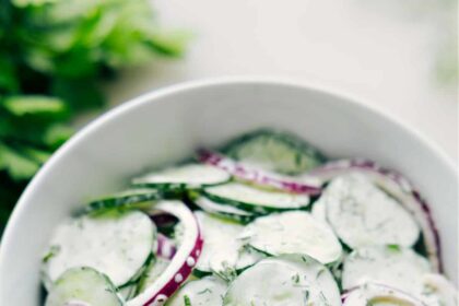 Creamy Cucumber Salad recipe in a bowl ready to be enjoyed.