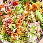 A bowl of shrimp avocado salad.