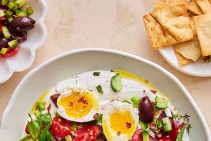 A bowl of whipped cottage cheese salad topped with an egg.