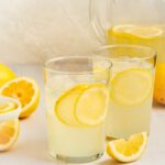 glasses of homemade lemonade with a pitcher