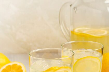 glasses of homemade lemonade with a pitcher