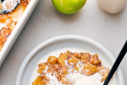 Apple Dump Cake on a plate with ice cream.