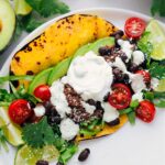 Shredded Beef Tacos on a plate with all the delicious toppings.